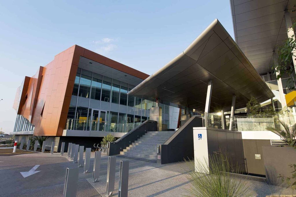 The entrance to a modern building with stairs.